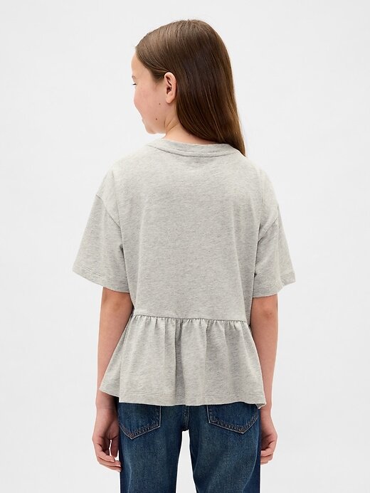 Dziecięca koszulka z nadrukiem peplum Dziecięca koszulka z nadrukiem peplum
