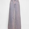 Jeansy UltraSoft Baggy o średnim stanie