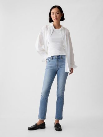 Jeansy vintage slim ze średnim stanem i rozcięciem u dołu