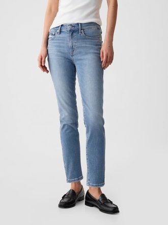 Jeansy vintage slim ze średnim stanem i rozcięciem u dołu