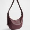 Wegańska skórzana torba typu crossbody z luźną podszewką